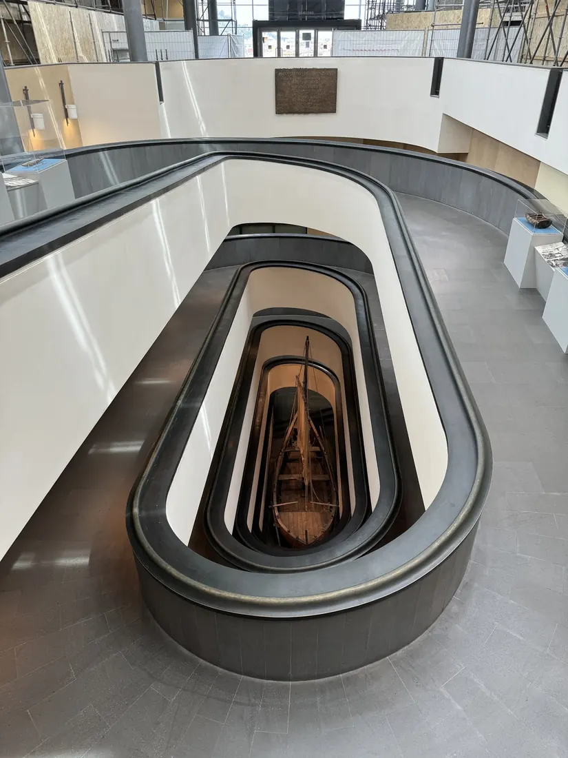 A curving white ramp spiralling down through the Vatican Museums, seen from above