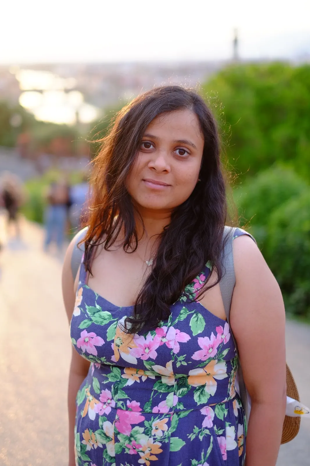 Portrait of Arsha in a flowery jumpsuit in the golden evening light at Piazzale Michelangelo