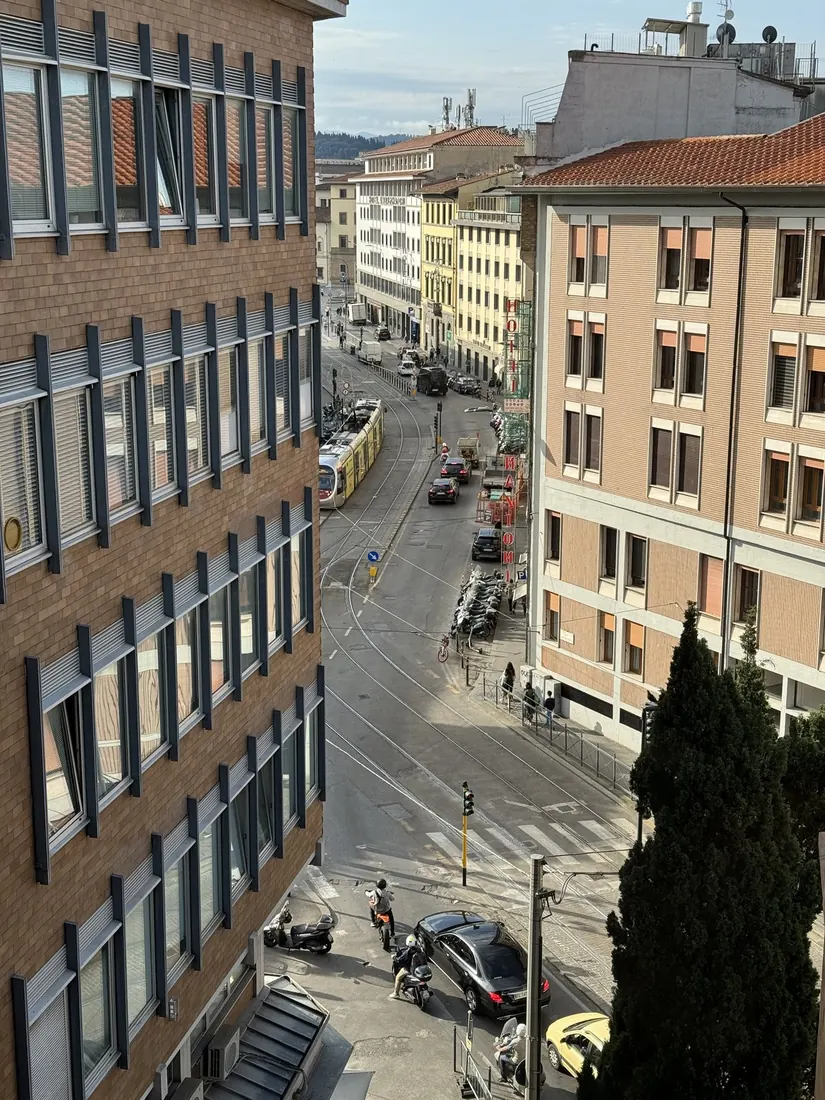 A Florence street seen from a high hotel window in the morning