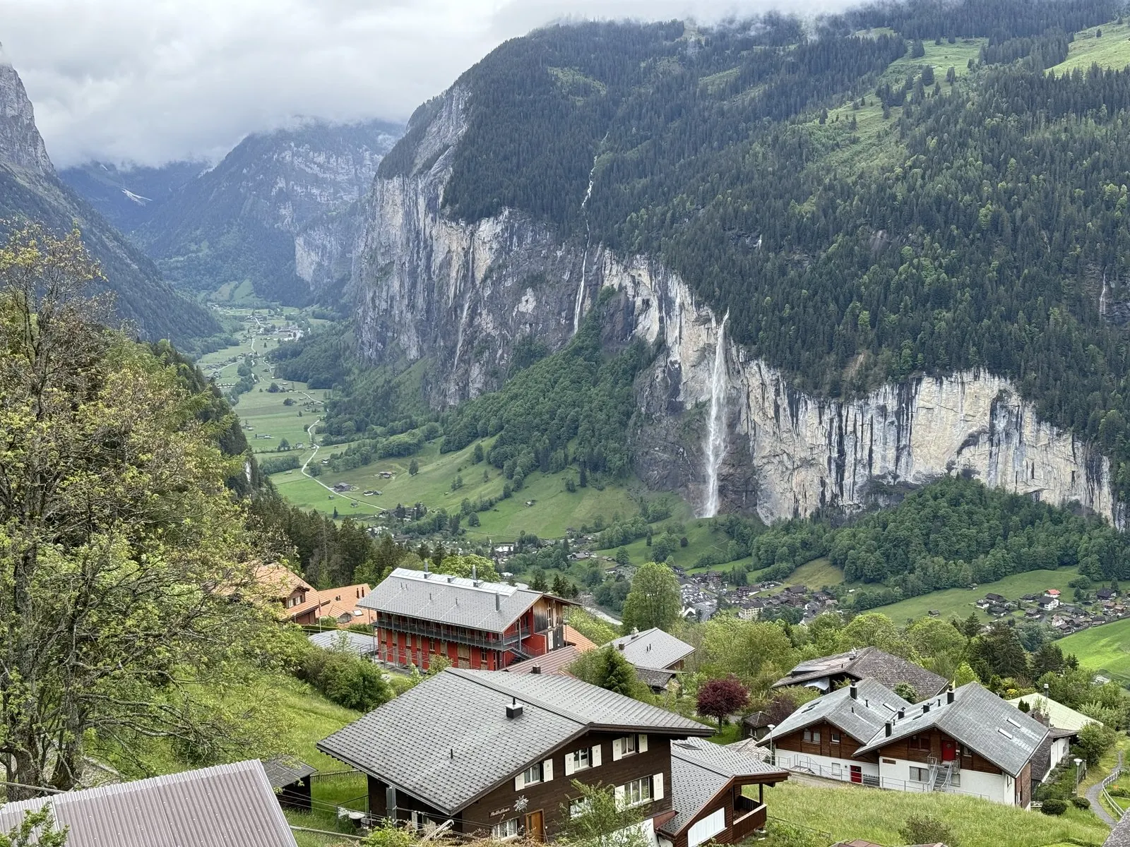 The Lauterbrunnen valley from Wengen: sheer cliffs, ribbon waterfalls and chalets far below