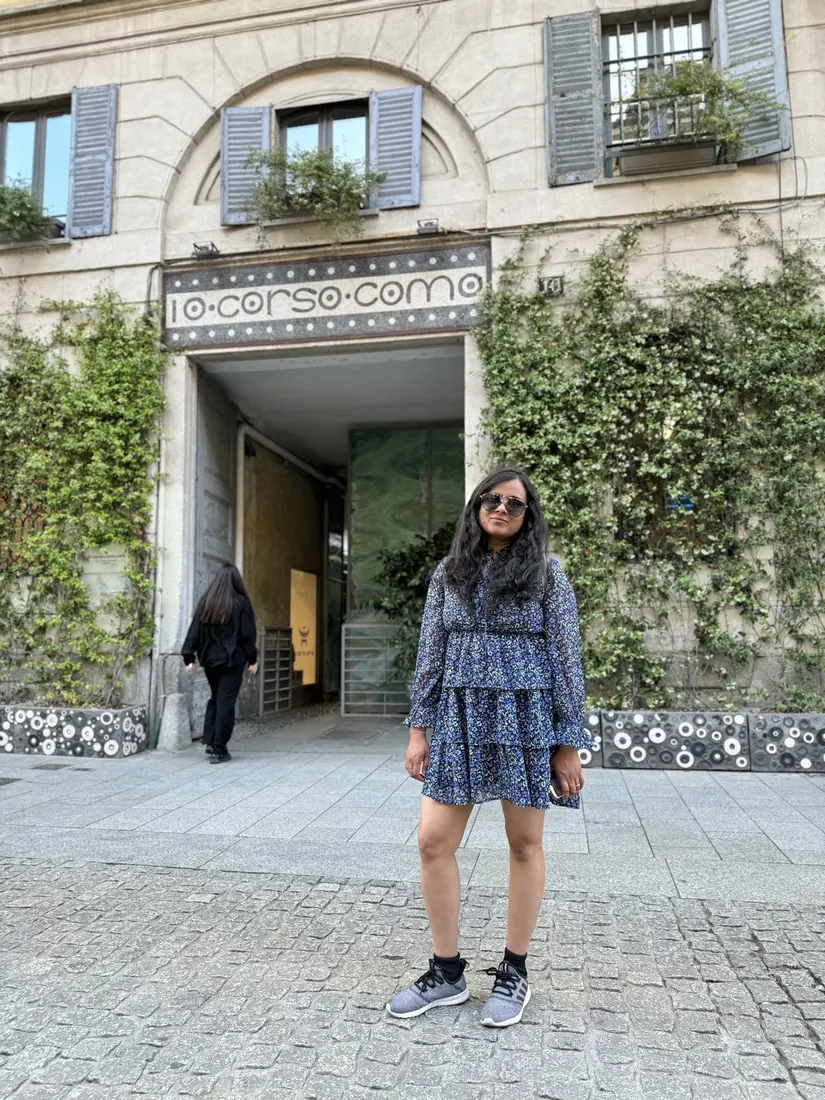 Arsha outside the green-covered entrance of 10 Corso Como